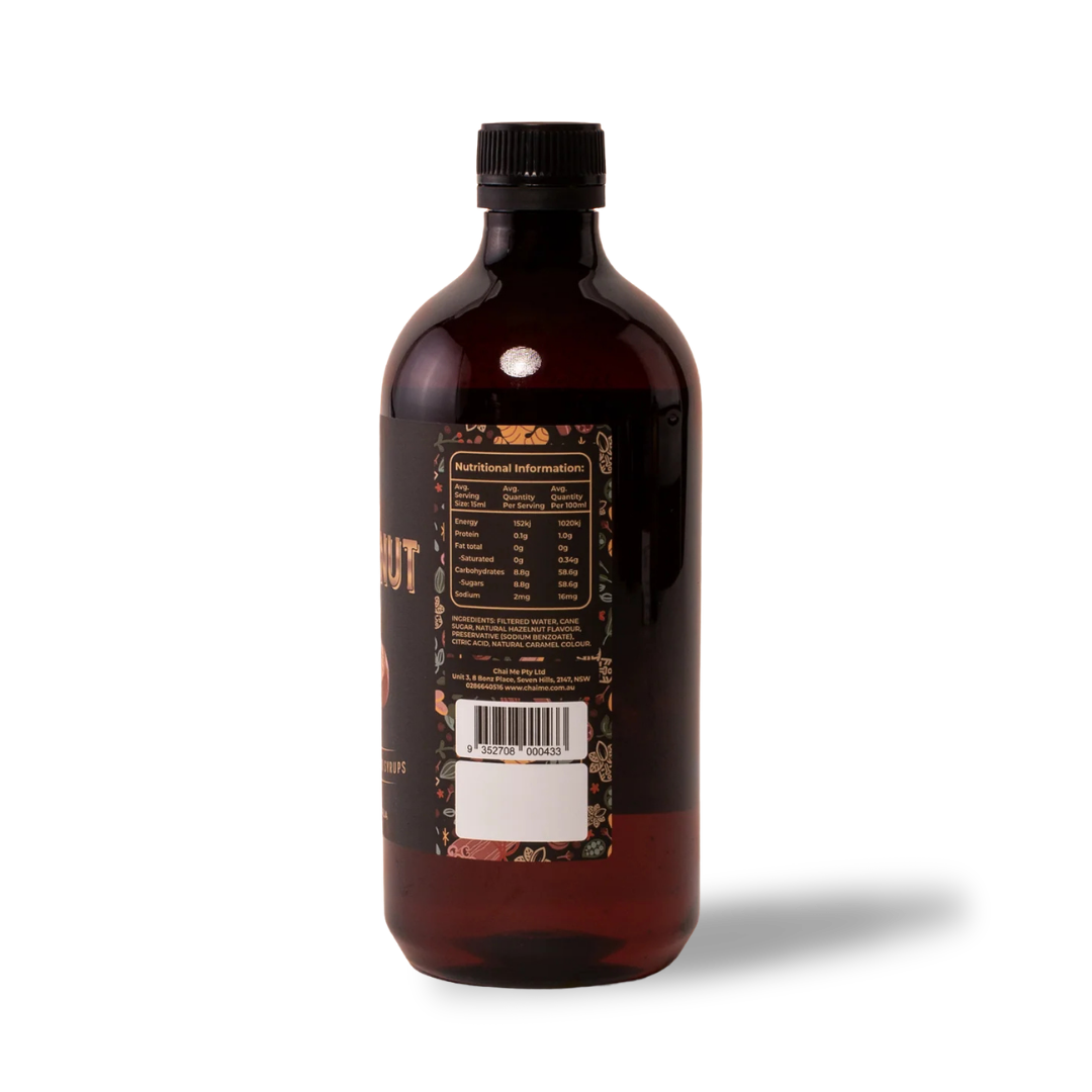 Chai Me coffee syrup bottle side view of Hazelnut flavoured syrup showing nutrition information on a white background. 